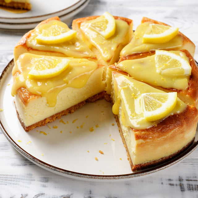 Lemon curd cheesecake topped with sugar free lemon curd and lemon slices, no added sugar, gluten free, keto friendly