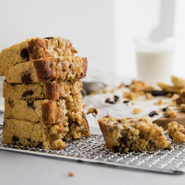 A stack of sliced low carb banana bread on a wire rack.